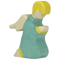 Wooden figurine of a girl in a blue dress with yellow accents on a white background