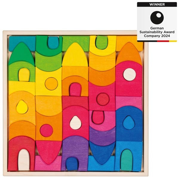 Colorful wooden building blocks in a box with a 'Winner' label for German Sustainability Award Company 2024.