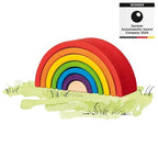 Colorful wooden rainbow toy on a grassy patch with a 'Winner' label for German Sustainability Award Company 2024.