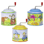 Three colorful tin musicboxes with cartoon designs on a white background