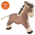 Wooden donkey toy with 'spiel gut' logo on a white background