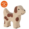 Wooden dog toy with brown patches on a white background, featuring the 'spiel gut' logo.