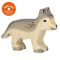 Wooden wolf figurine with 'spiel gut' logo on a white background