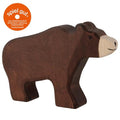 Wooden bear toy with 'spiel gut' certification logo on a white background