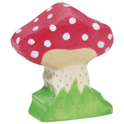 Wooden mushroom figurine with a red cap and white spots on a green base