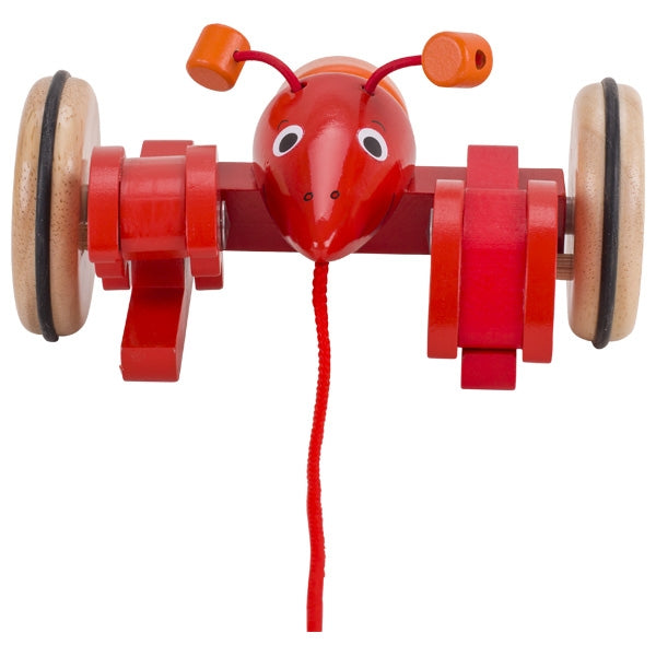 Red toy lobster with wooden wheels on a white background
