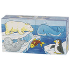 Set of animal-themed building blocks with polar bear, whale, seal, fish, penguin, and whale on a blue water background.
