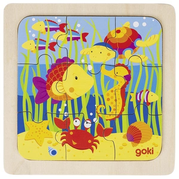Children's puzzle with colorful underwater scene featuring fish and a crab, brand 'goki' visible.