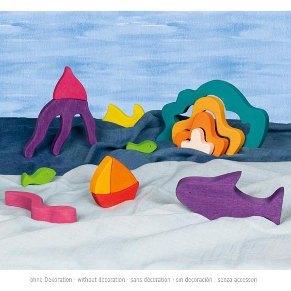 Colorful wooden sea creature toys on a blue and white background