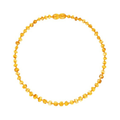 Round amber necklace on a white background