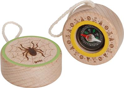 Wooden compass with spider design and compass center on a white background