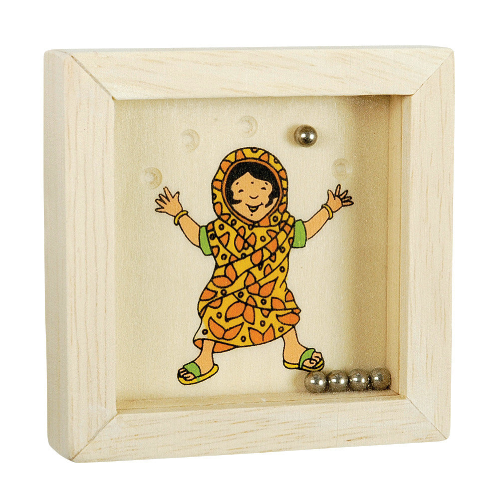Wooden box with a colorful illustration of a child in a patterned dress, surrounded by small metallic objects.