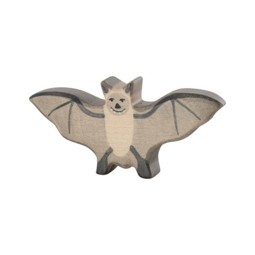 Bat-shaped toy on a beige background