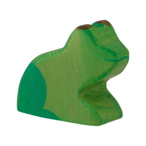 Green wooden frog toy on a white background