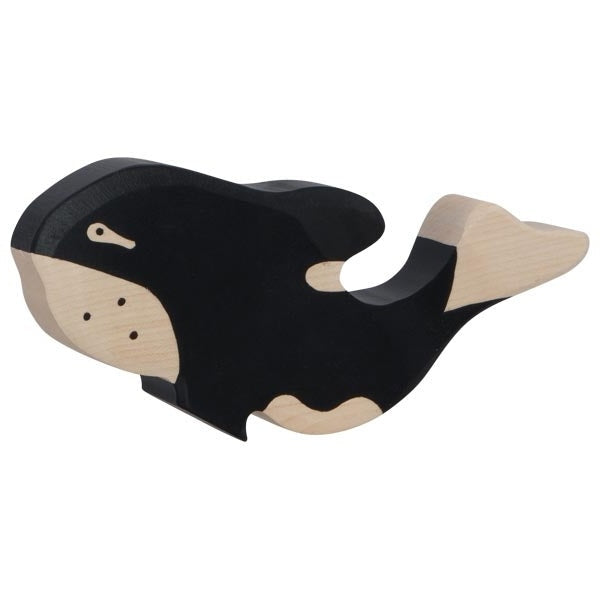 Wooden toy whale on a white background