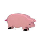 Pink wooden pig figure on a white background